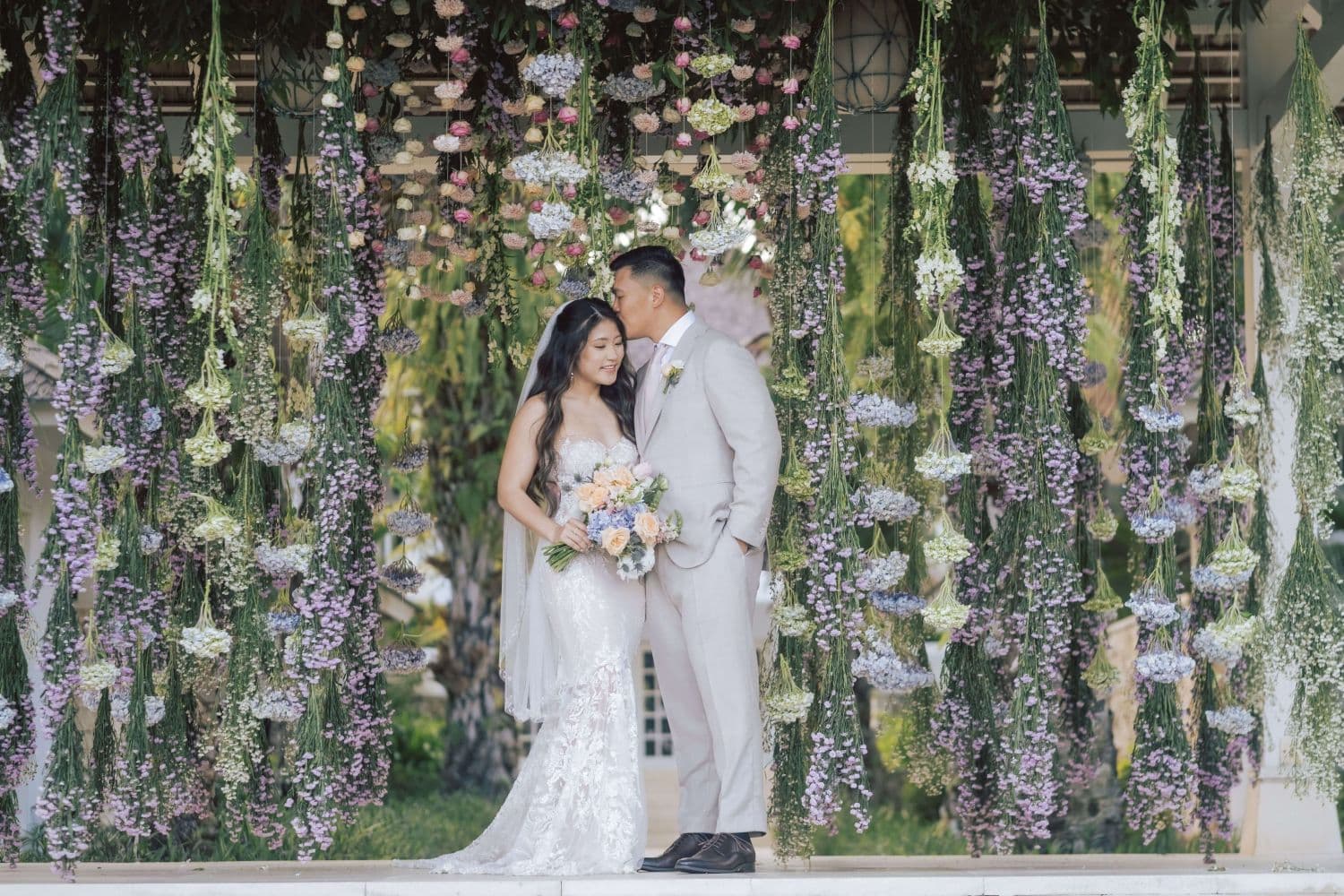 A couple wedding at the Ungasan with floral background
